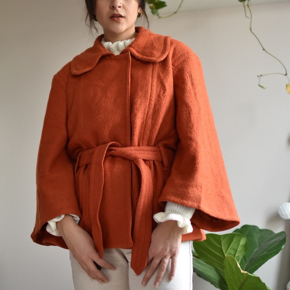 Burnt orange jacket with round collar and wide sleeves
